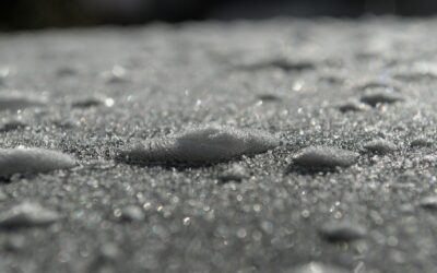 drops of water on a surface with a blurry background